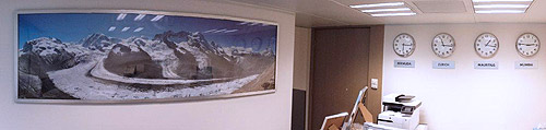 Panoramic photo of a mountain landscape in the reception area of a company.