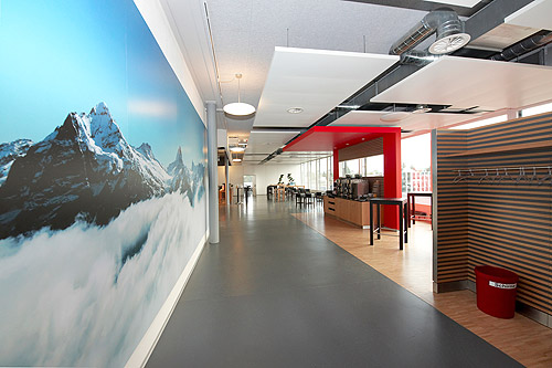 Large wall photo with alpine panorama in staff restaurant.